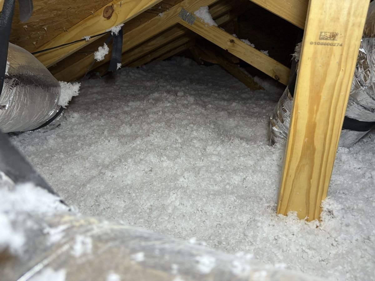 Attic after blown-in insulation installation, restoring R-value in Manatee County, Florida